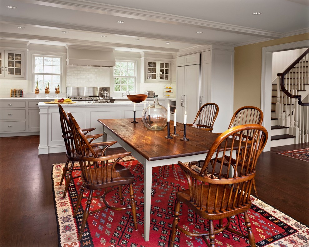 Example of a large classic medium tone wood floor dining room design in New York