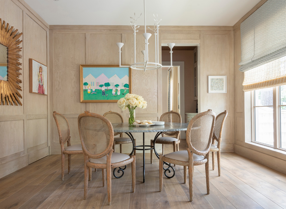 Inspiration for a transitional light wood floor and beige floor enclosed dining room remodel in Houston with beige walls and no fireplace