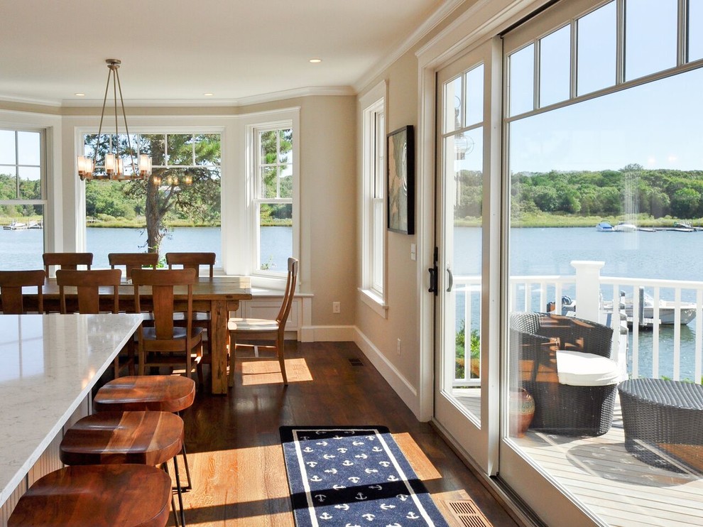 Design ideas for a medium sized nautical kitchen/dining room in Boston with beige walls, medium hardwood flooring, no fireplace and brown floors.
