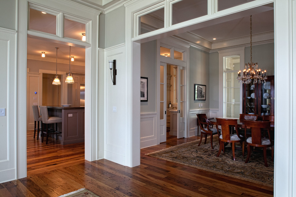 Large traditional enclosed dining room in Charleston with green walls, medium hardwood flooring and no fireplace.