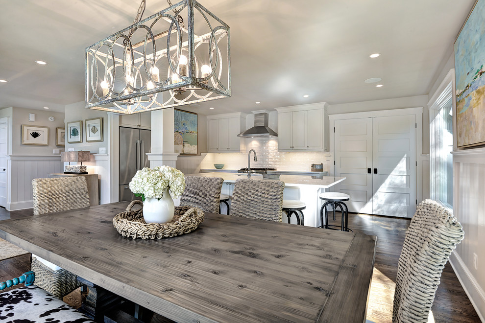 Example of a mid-sized beach style dark wood floor and brown floor kitchen/dining room combo design in Charleston with no fireplace