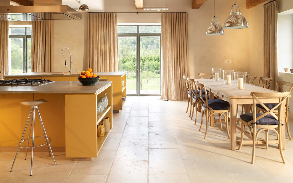 This is an example of a large rural kitchen/dining room in New York with travertine flooring, beige walls, no fireplace and beige floors.