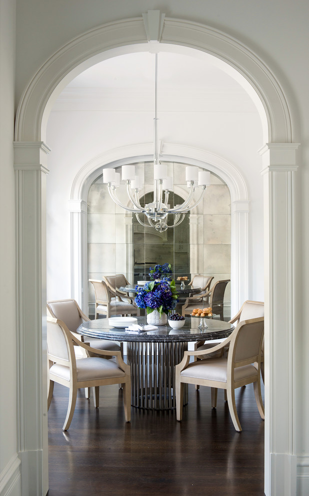 Design ideas for a classic dining room in New York with white walls and dark hardwood flooring.