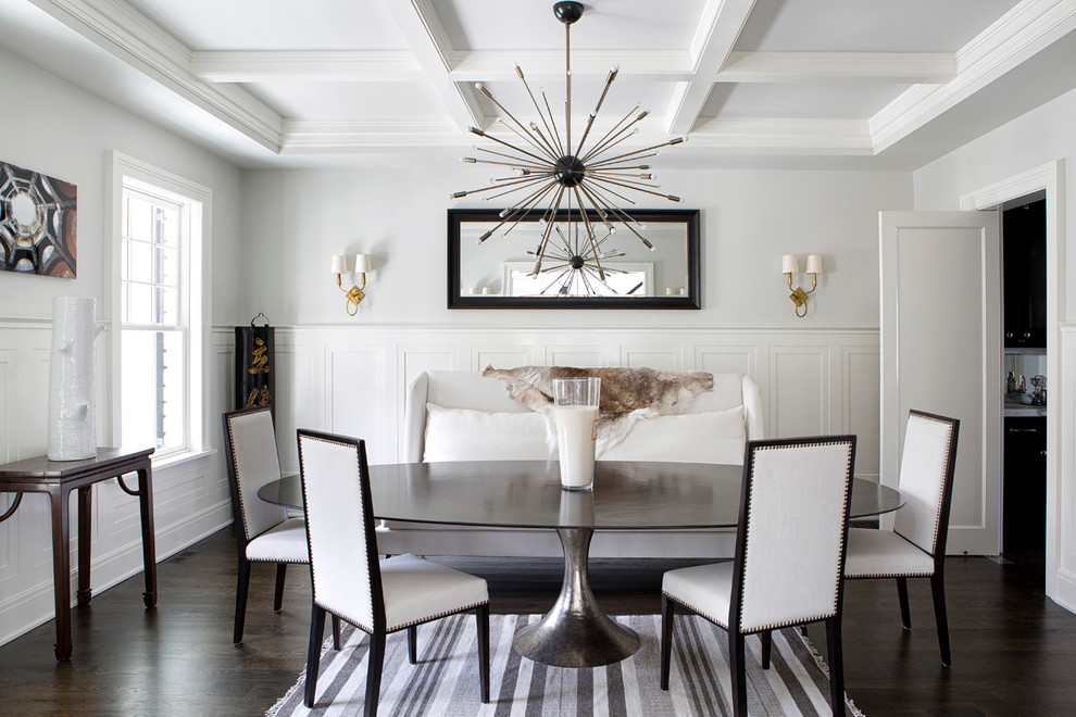 Example of a transitional dark wood floor dining room design in New York with no fireplace and gray walls