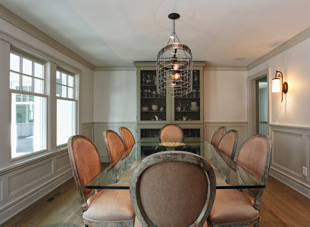 Design ideas for a classic enclosed dining room in New York.