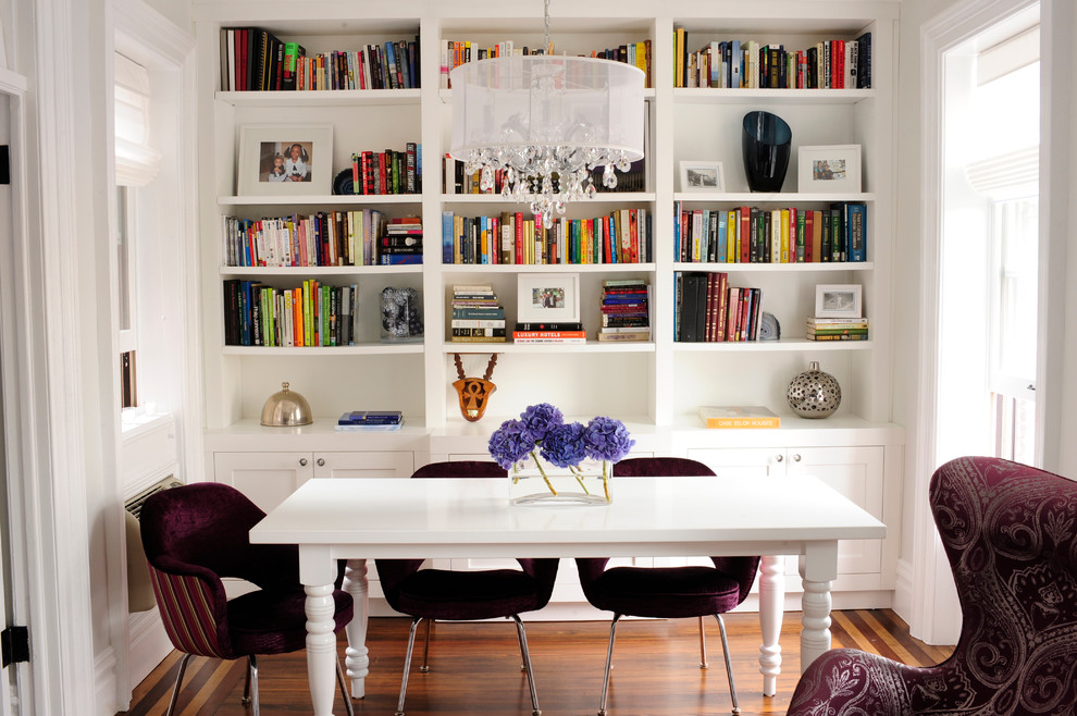 Example of a transitional dark wood floor dining room design in New York with white walls