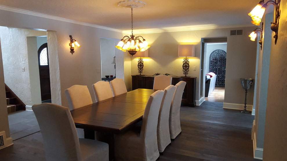 Large classic enclosed dining room in Detroit with grey walls and dark hardwood flooring.