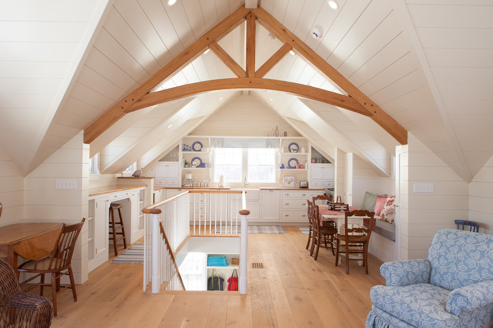Example of a mid-sized beach style medium tone wood floor great room design in Boston