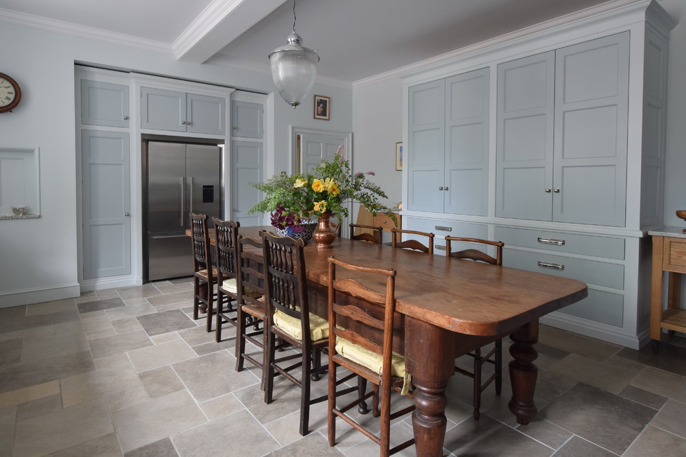 Medium sized classic dining room in Wiltshire with ceramic flooring.