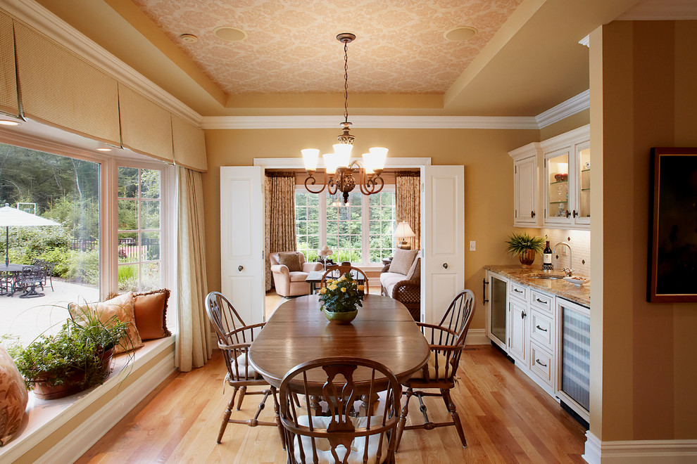 Inspiration for a timeless medium tone wood floor dining room remodel in New York