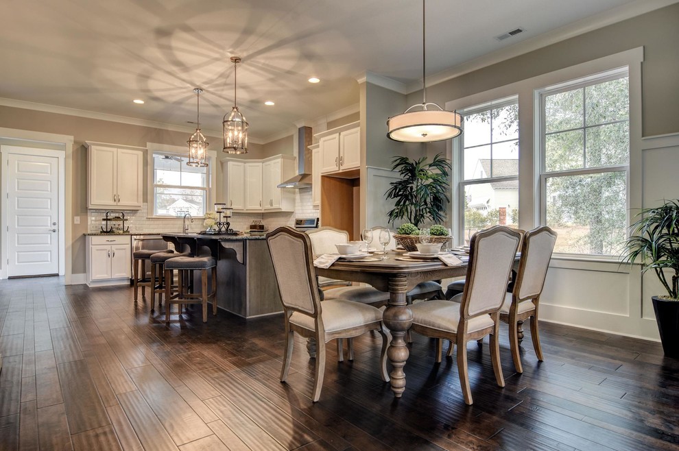 This is an example of a medium sized beach style open plan dining room in Other with grey walls, dark hardwood flooring, no fireplace and brown floors.