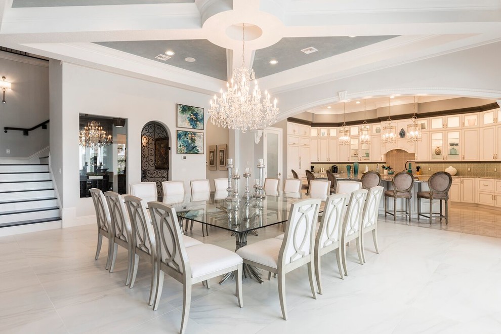 Inspiration for a mediterranean dining room in Orlando with grey walls and grey floors.