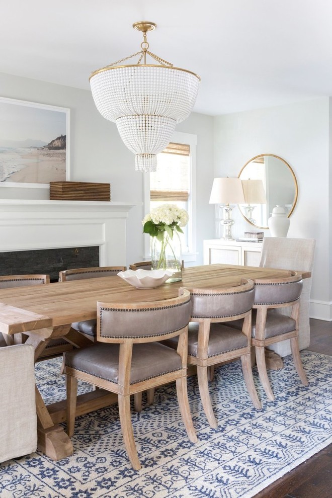 Mid-sized trendy dark wood floor kitchen/dining room combo photo in Salt Lake City with gray walls and a standard fireplace