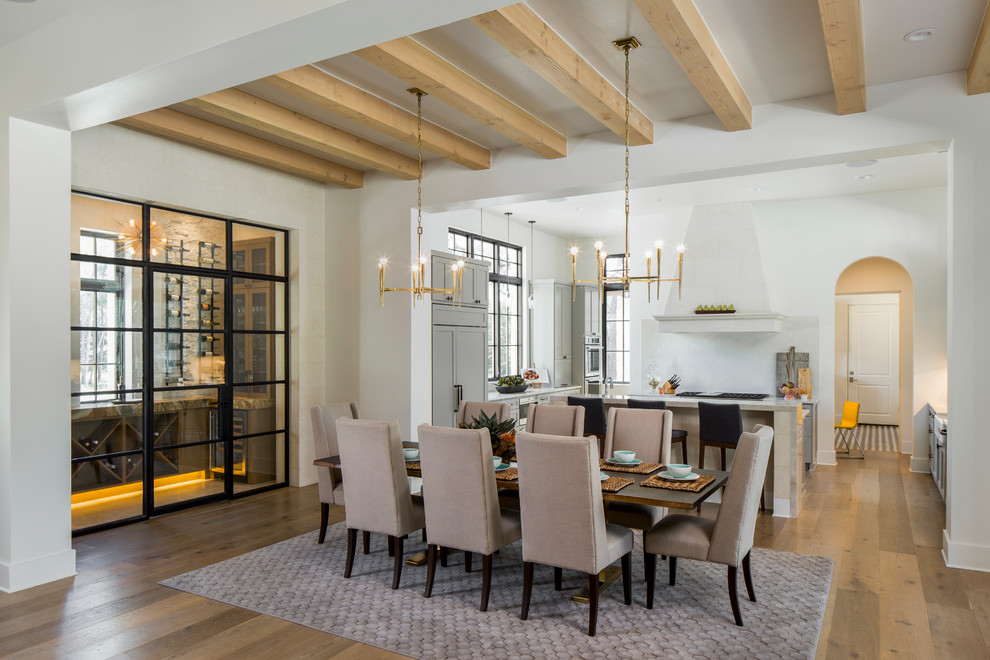 Design ideas for a large traditional kitchen/dining room in Austin with white walls and light hardwood flooring.