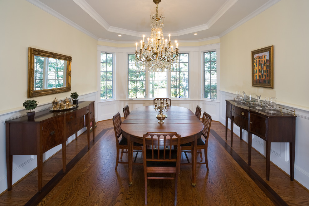 Inspiration for a traditional dining room in DC Metro with beige walls and medium hardwood flooring.