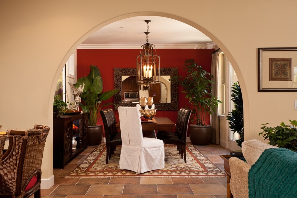 Medium sized mediterranean enclosed dining room in San Diego with beige walls, slate flooring and no fireplace.