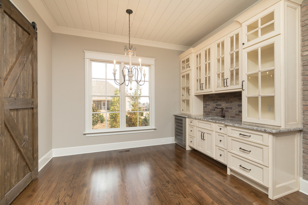 Example of a mid-sized arts and crafts dark wood floor kitchen/dining room combo design in Other with gray walls and no fireplace