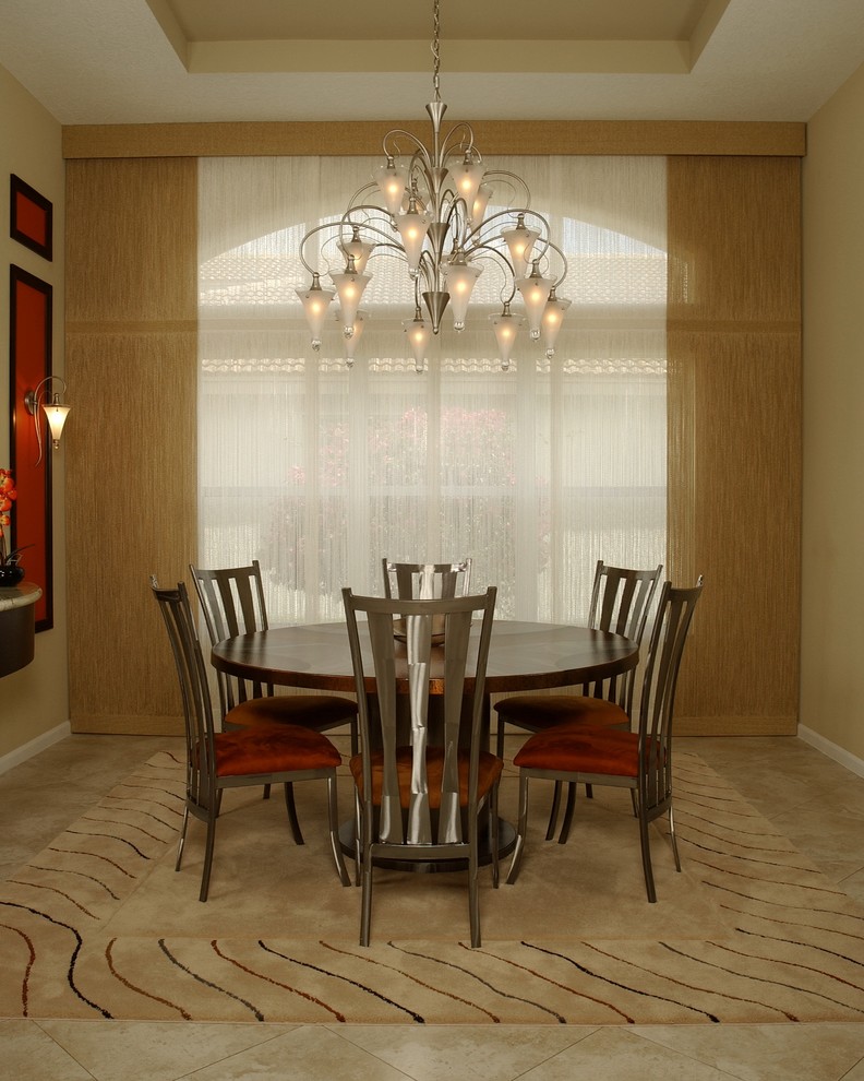 Medium sized classic enclosed dining room in Miami with beige walls, carpet, no fireplace and beige floors.