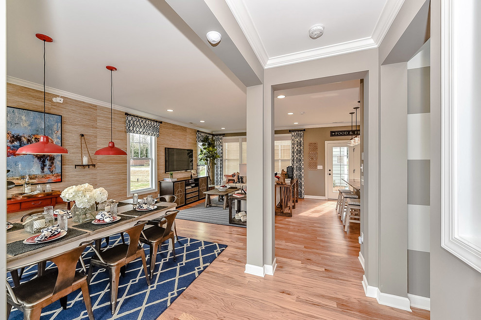 Design ideas for a small country open plan dining room in Charlotte with grey walls, light hardwood flooring and no fireplace.