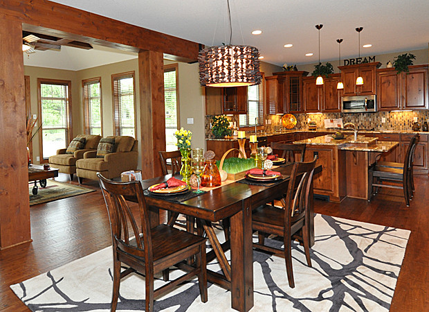 Inspiration for a large contemporary dark wood floor kitchen/dining room combo remodel in Milwaukee with brown walls