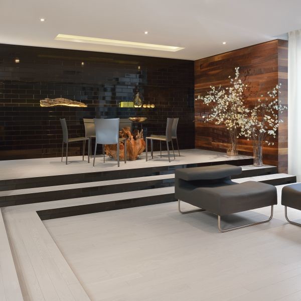 Inspiration for a light wood floor and white floor dining room remodel in Toronto with black walls