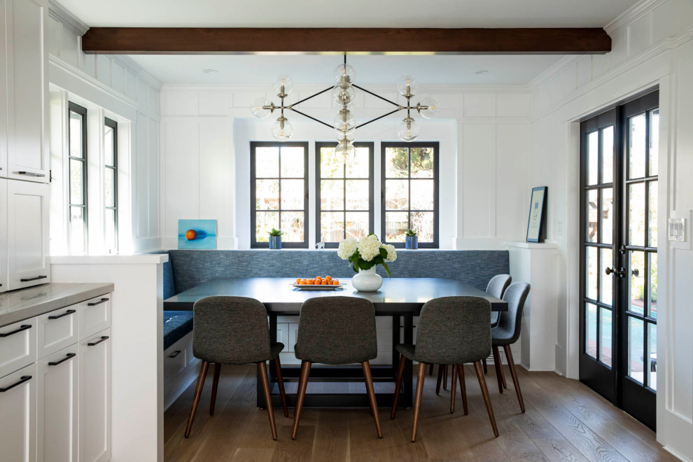 Design ideas for a large classic kitchen/dining room in San Francisco with white walls, medium hardwood flooring, brown floors, exposed beams and panelled walls.