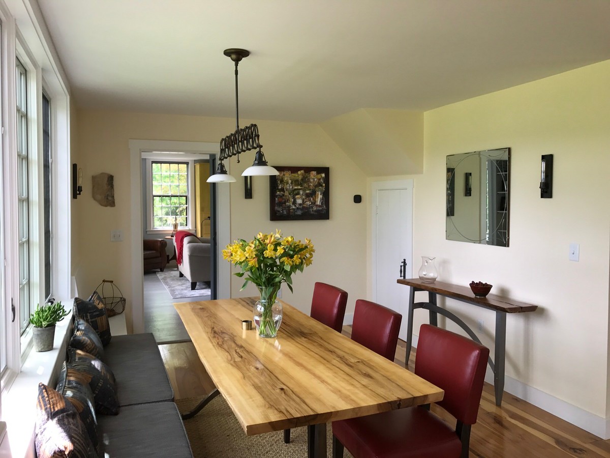 Kitchen/dining room combo - mid-sized transitional medium tone wood floor kitchen/dining room combo idea in Boston with yellow walls