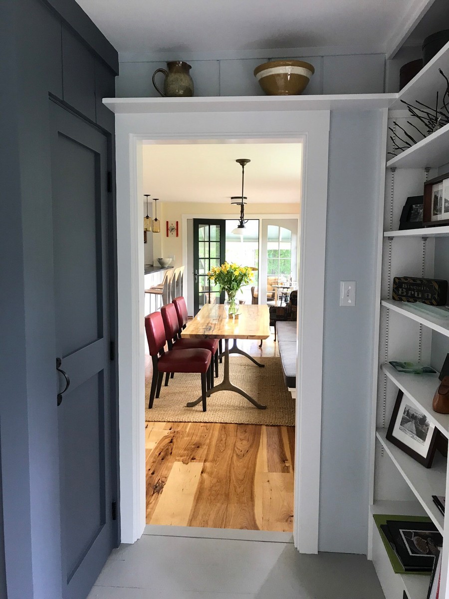Inspiration for a mid-sized transitional medium tone wood floor kitchen/dining room combo remodel in Boston with yellow walls