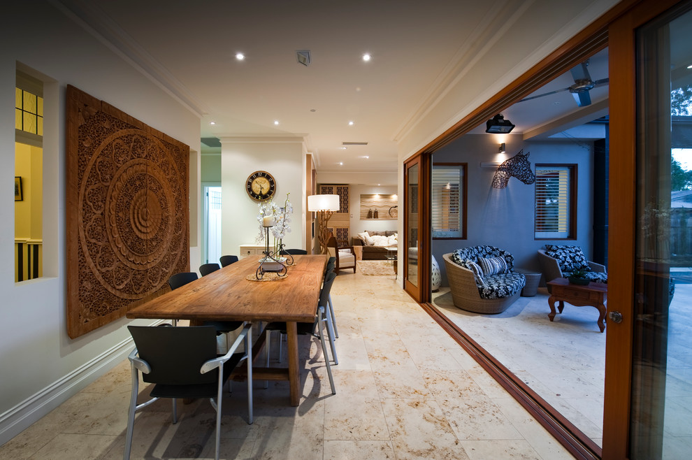 This is an example of a large contemporary open plan dining room in Adelaide with white walls and a standard fireplace.