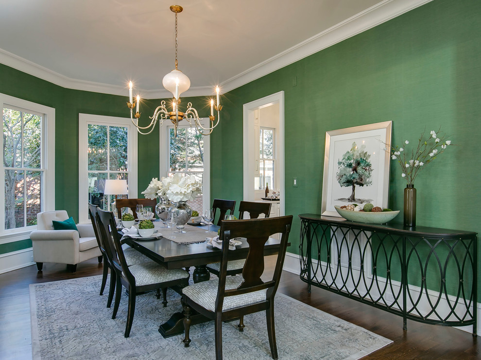 Design ideas for a traditional enclosed dining room in Raleigh with green walls, dark hardwood flooring and brown floors.