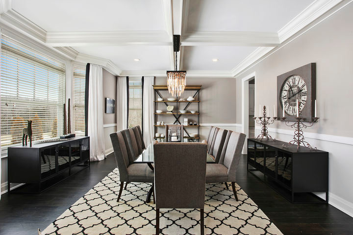 Inspiration for a medium sized traditional enclosed dining room in New York with beige walls, dark hardwood flooring, no fireplace and beige floors.