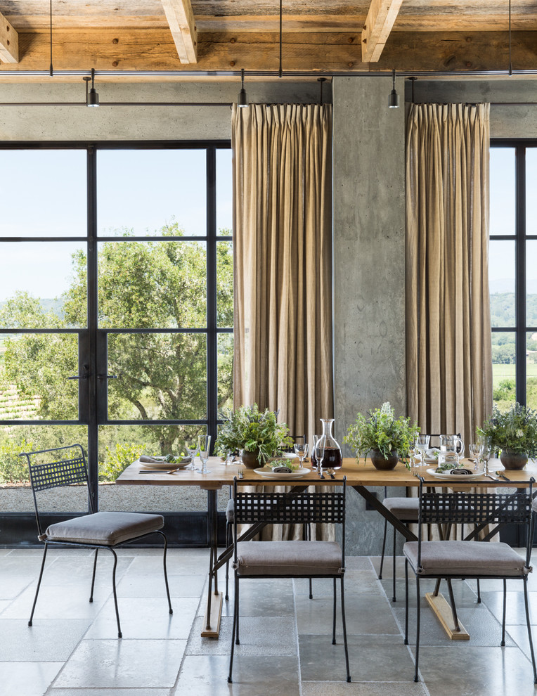 Example of a country dining room design in San Francisco with gray walls