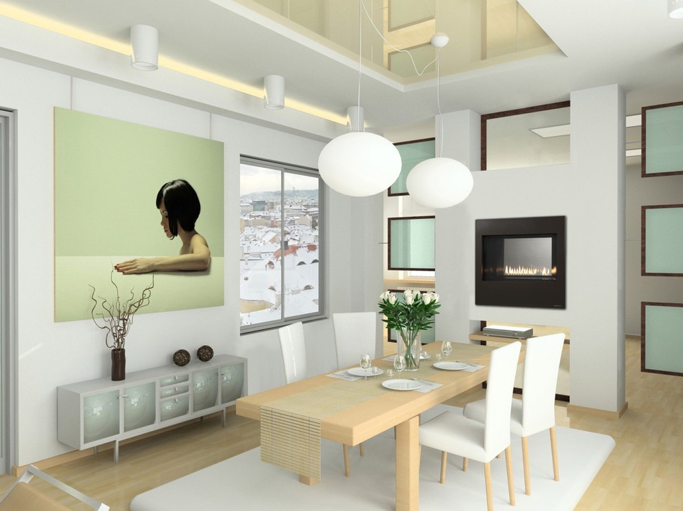 Idée de décoration pour une salle à manger minimaliste fermée et de taille moyenne avec un mur blanc, parquet clair, une cheminée double-face, un manteau de cheminée en métal et un sol beige.