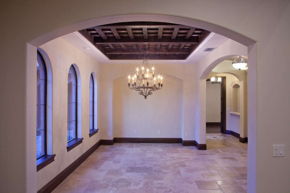 Enclosed dining room - large mediterranean travertine floor enclosed dining room idea in Orlando with white walls