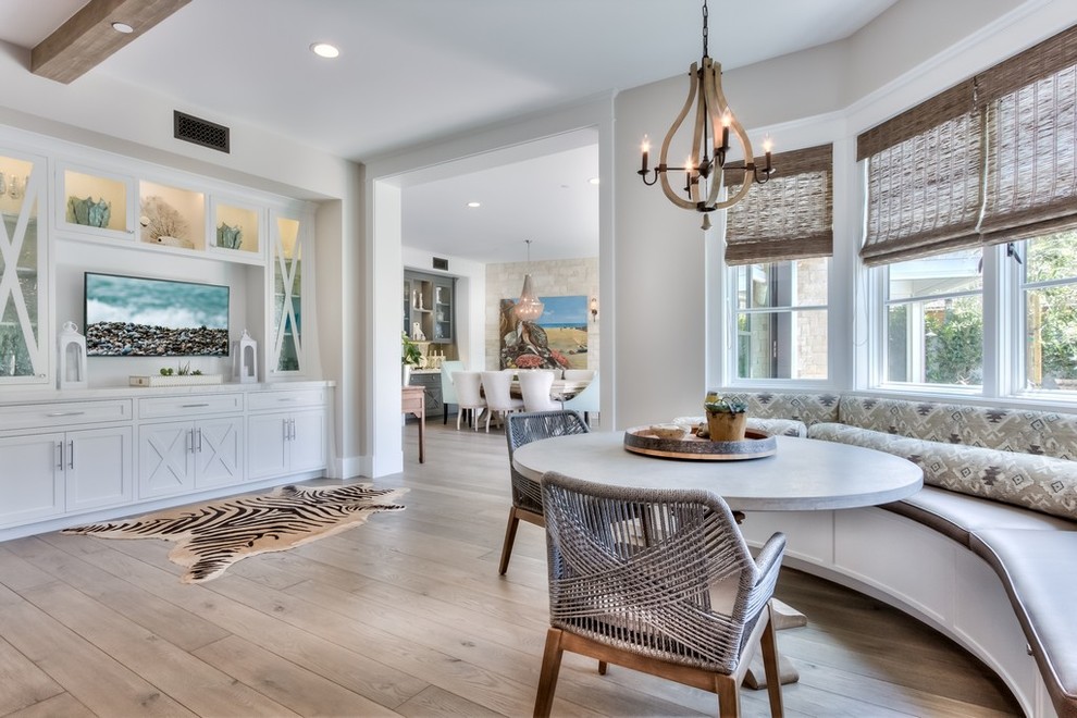 Example of a mid-sized farmhouse medium tone wood floor and brown floor kitchen/dining room combo design in Orange County with brown walls and no fireplace