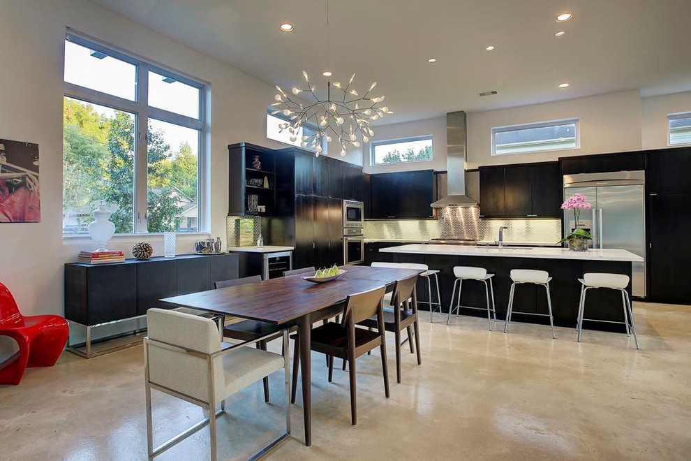This is an example of a contemporary dining room in Houston.
