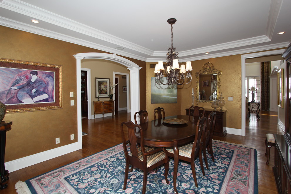 Photo of a medium sized traditional open plan dining room in Cincinnati with metallic walls and medium hardwood flooring.