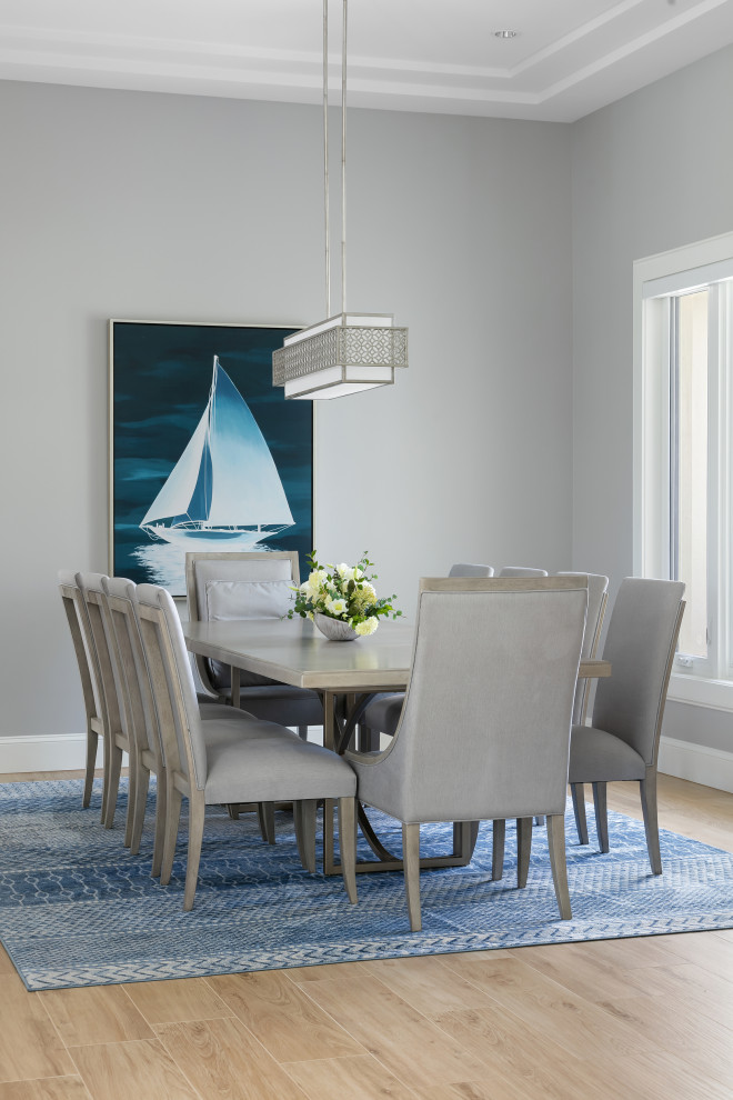 Design ideas for a medium sized coastal open plan dining room in Tampa with grey walls, porcelain flooring and brown floors.