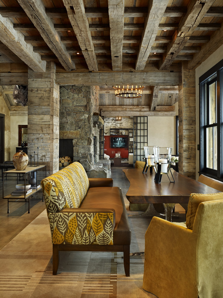 This is an example of a rustic dining room in Denver.