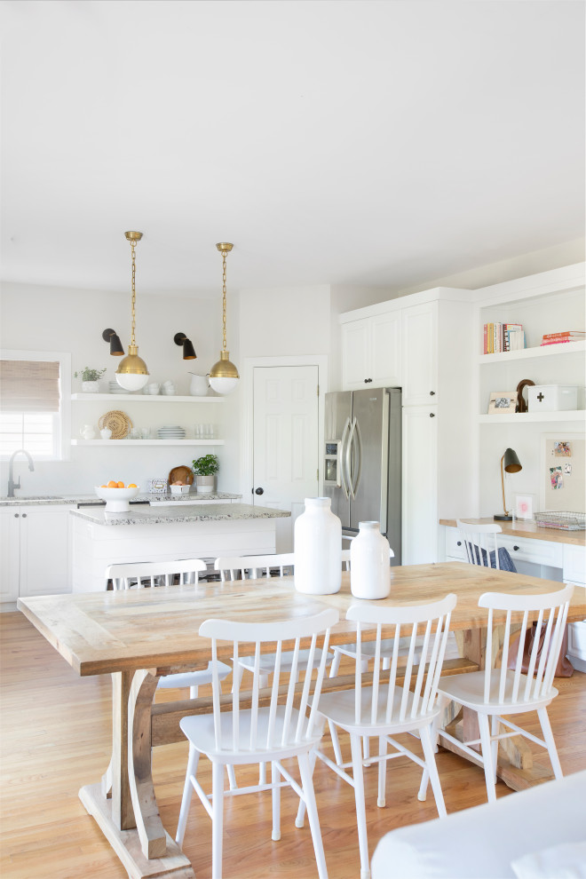 Kitchen/dining room combo - mid-sized transitional medium tone wood floor and beige floor kitchen/dining room combo idea in Charleston with white walls