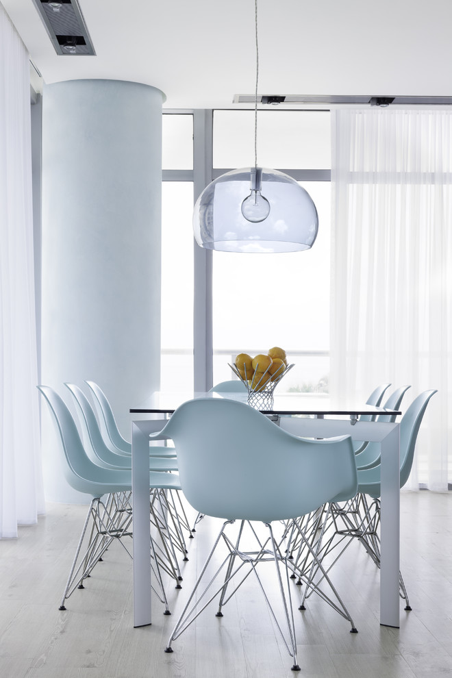 Trendy dining room photo in Miami with white walls