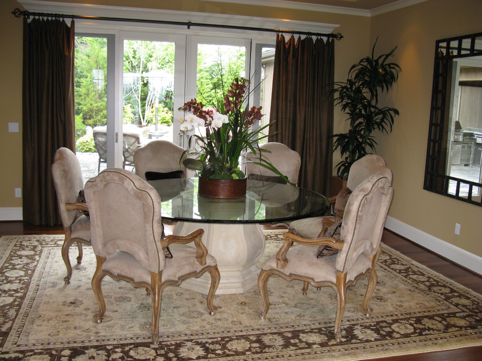 This is an example of a medium sized traditional enclosed dining room in Seattle with beige walls, medium hardwood flooring and no fireplace.