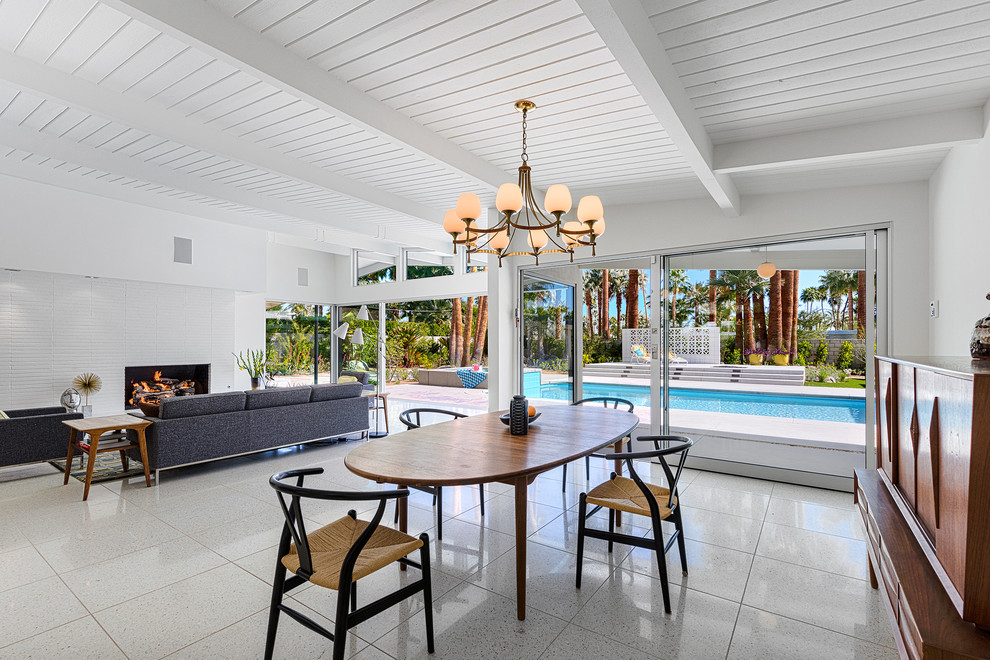 Inspiration for a mid-sized 1960s great room remodel in Other with white walls and no fireplace
