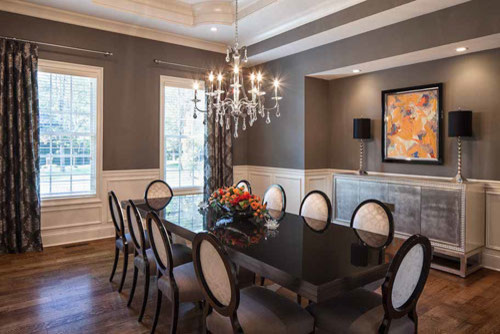Large contemporary enclosed dining room in Cincinnati with grey walls, dark hardwood flooring, no fireplace and brown floors.