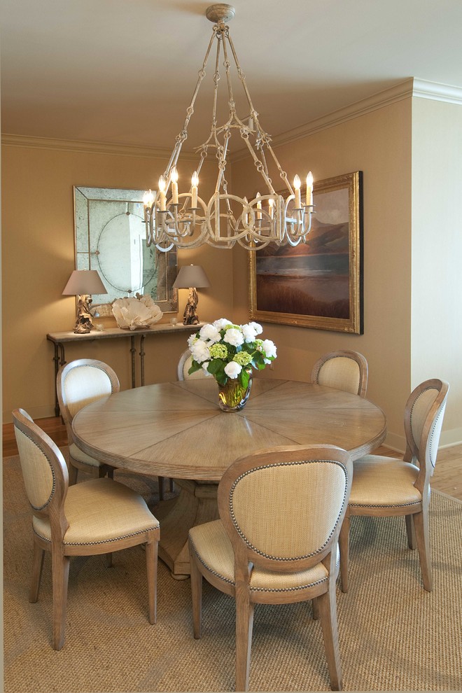 Design ideas for a small traditional open plan dining room in Houston with beige walls, medium hardwood flooring and no fireplace.