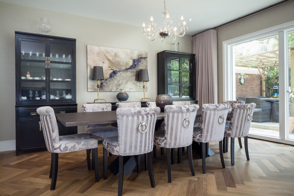 Photo of a classic dining room in London with beige walls, medium hardwood flooring, no fireplace and brown floors.
