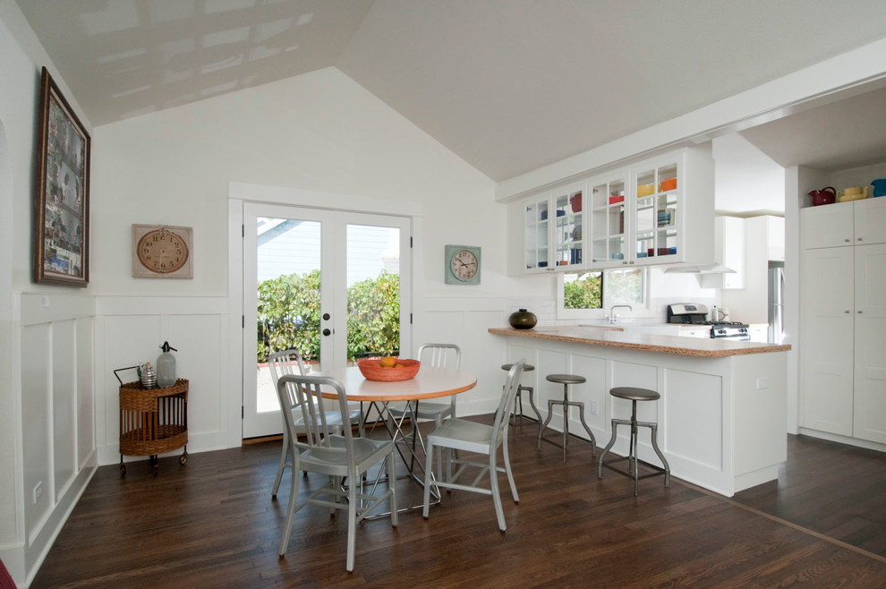 Example of a mid-sized country dark wood floor kitchen/dining room combo design in Los Angeles with white walls