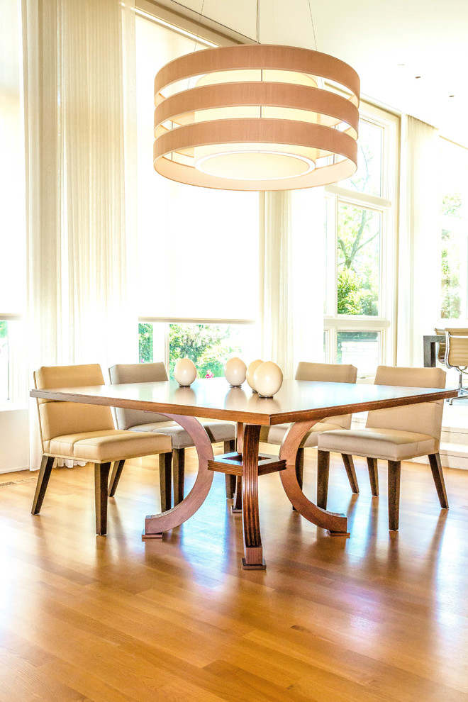Design ideas for a traditional open plan dining room in Chicago with medium hardwood flooring.