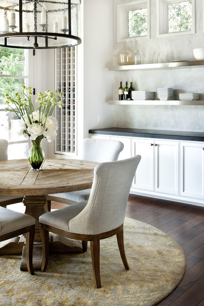 Example of a mountain style dark wood floor and brown floor dining room design in Austin