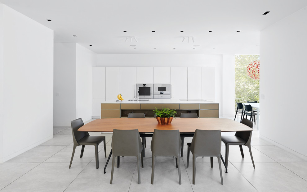 Inspiration for a contemporary kitchen/dining room in San Francisco with white walls and grey floors.